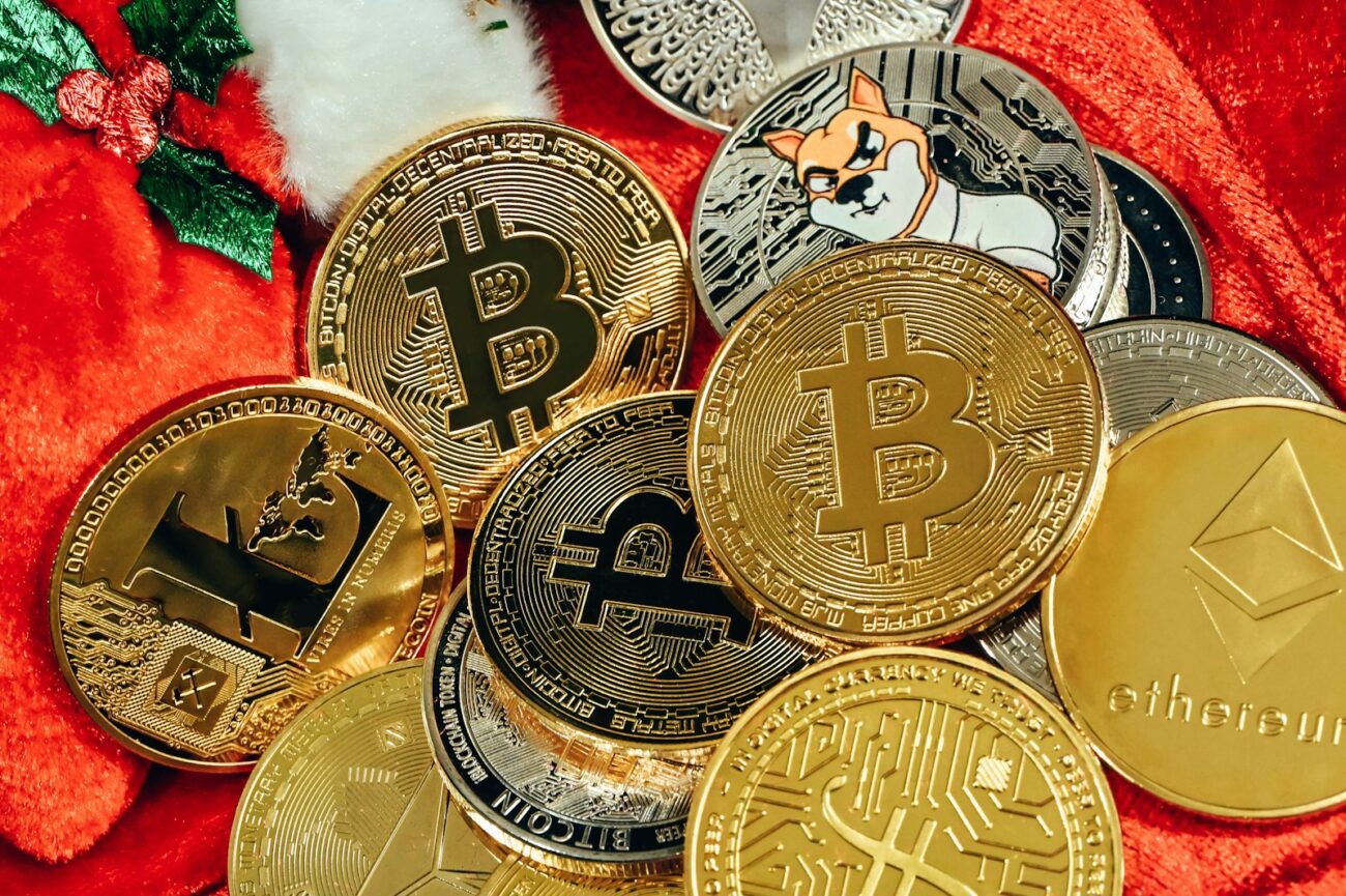 a pile of bitcoins sitting on top of a red blanket